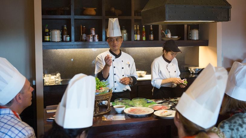 Surachai Kakaew, executive sous chef at the Anantara Resort Chiang Rai, Thailand, conducts a cooking class for guests. (George Hobica/TNS)
