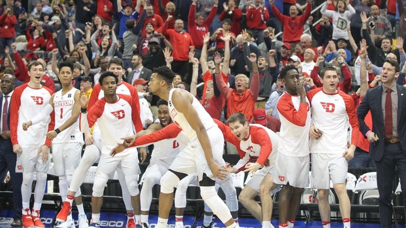 Dayton's bench reacts after a 3-pointer by Charles Cooke late in the second half against Davidson in the Atlantic 10 tournament quarterfinals on March 10, 2017, at PPG Paints Arena in Pittsburgh.