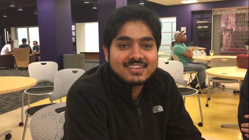 Nathan Balasubramanian, a graduate student from India, sits at a dinner celebrating international education week at Wright State. Balasubramanian said he is worried about what the election of Donald Trump will mean for him and his peers. MAX FILBY/ STAFF