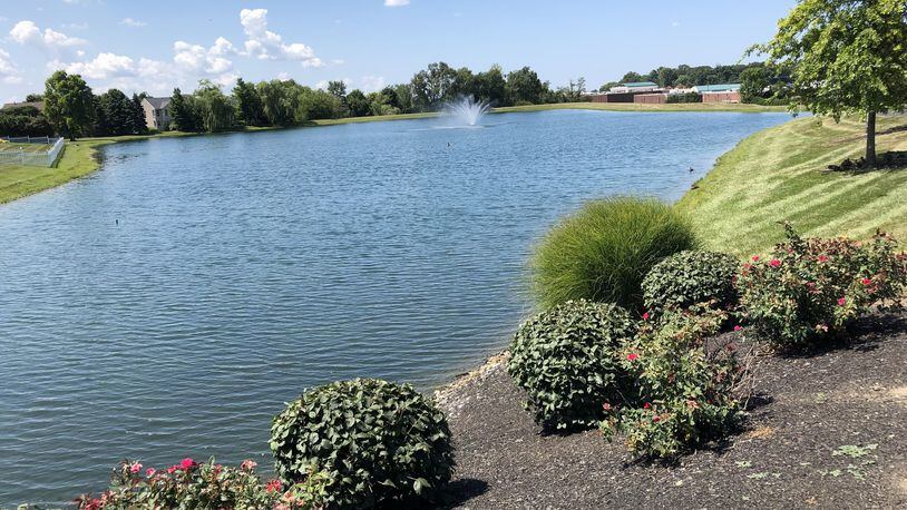 The Ohio Attorney General’s Office has sued the Settlers Walk Homeowners Association and MCS Land Development over the condition of the dam holding this body of water off Remick Road in Springboro. STAFF/LAWRENCE BUDD
