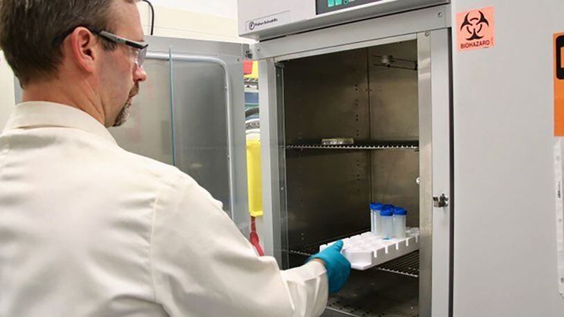 Bruce Salter, a senior research scientist at the Air Force Civil Engineer Center, works on non-toxic, anti-microbial compounds at the Civil Engineer Lab at Tyndall Air Force Base, Fla. (Courtesy photo/Theriax)