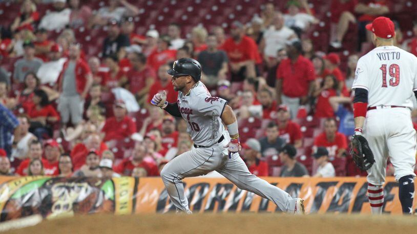 The White Sox’s Yoan Moncada triples to drive in three runs in the 12th inning against the Reds on Tuesday, July 3, 2018, at Great American Ball Park in Cincinnati.