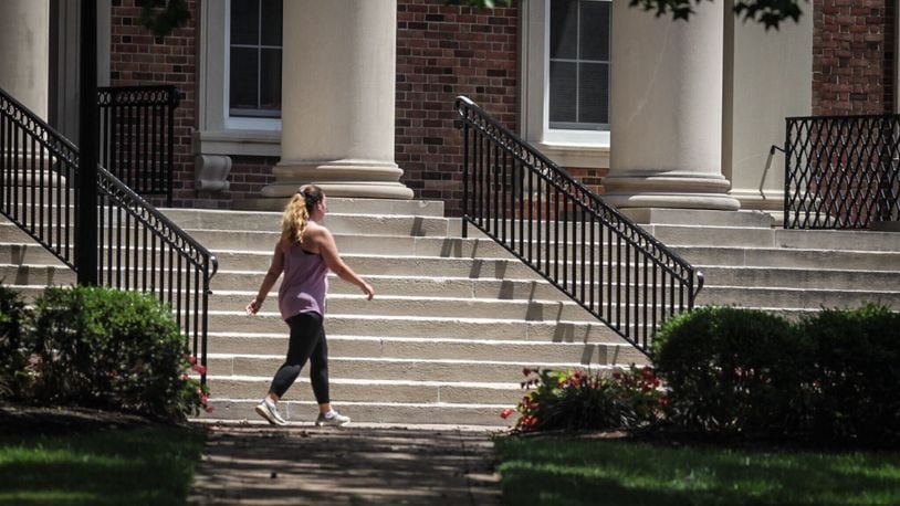 A woman exercises on the UD campus Monday July 13, 2020. Jim Noelker/Staff