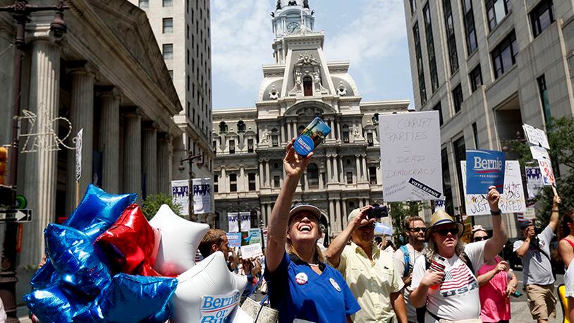 Demonstrators make their way around downtown, Monday, July 25, 2016, in Philadelphia, during the first day of the Democratic National Convention. (AP Photo/John Minchillo)