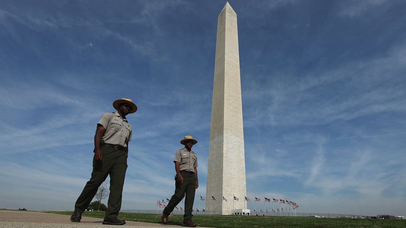 WASHINGTON, DC - AUGUST 24:  U.S. Park rangers walk on the National Mall near the Washington Monument August 24, 2011 in Washington, DC. (Photo by Chip Somodevilla/Getty Images)