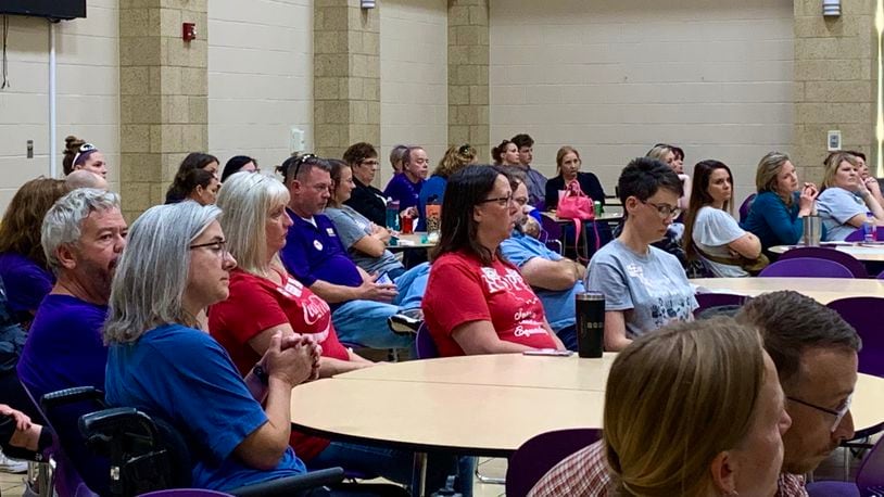 Staff and parents listen in the audience at Bellbrook-Sugarcreek Schools as the district, city, and township discuss funding for School Resource Officers Monday. LONDON BISHOP/STAFF