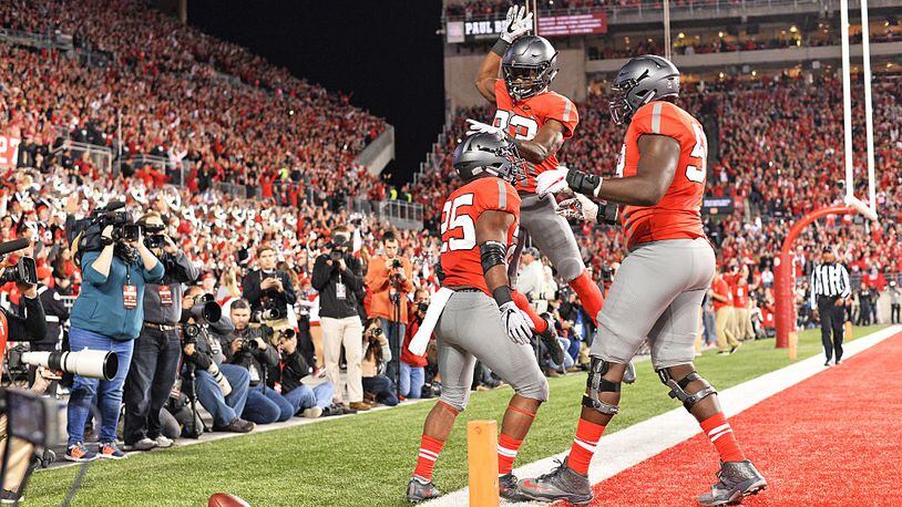COLUMBUS, OH - NOVEMBER 5: Mike Weber #25 of the Ohio State Buckeyes celebrates with Terry McLaurin #83 of the Ohio State Buckeyes and Isaiah Prince #59 of the Ohio State Buckeyes after scoring on a 23-yard touchdown run in the second quarter against the Nebraska Cornhuskers at Ohio Stadium on November 5, 2016 in Columbus, Ohio. (Photo by Jamie Sabau/Getty Images)