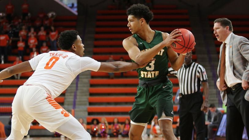 Clemson’s Clyde Trapp (2) guards Wright State’s Mark Hughes (3) as Clemson coach Brad Brownell watches during Tuesday night’s NIT game at Littlejohn Coliseum in Clemson, S.C. Clemson won 75-69. PHOTO COURTESY OF CLEMSON ATHLETICS