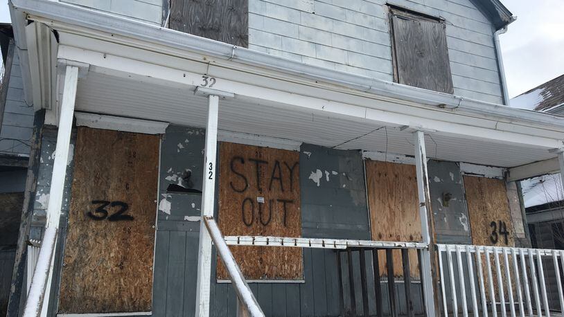 Vacant properties remain a problem in many Dayton neighborhoods. CORNELIUS FROLIK / STAFF