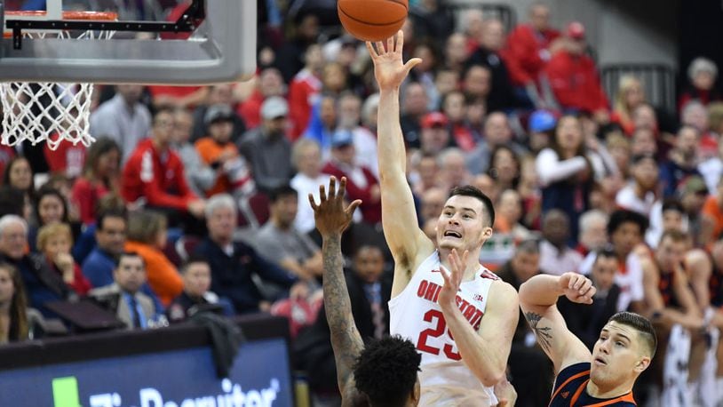 COLUMBUS, OH - DECEMBER 15:  Kyle Young #25 of the Ohio State Buckeyes shoots over Bruce Moore #13 of the Bucknell Bisons and Nate Sestina #4 of the Bucknell Bisons in the second half on December 15, 2018 at Value City Arena in Columbus, Ohio. Ohio State defeated Bucknell 73-71.  (Photo by Jamie Sabau/Getty Images)