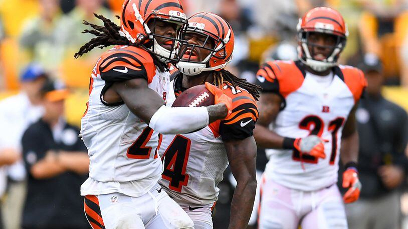 PITTSBURGH, PA - SEPTEMBER 18: Dre Kirkpatrick #27 of the Cincinnati Bengals celebrates his interception with Adam Jones #24 in the second quarter during the game against the Pittsburgh Steelers at Heinz Field on September 18, 2016 in Pittsburgh, Pennsylvania. (Photo by Joe Sargent/Getty Images)