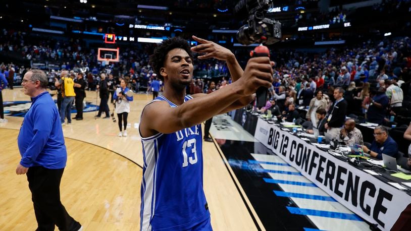 Duke's Sean Stewart records a video following a Sweet 16 college basketball game against Houston in the NCAA Tournament in Dallas, Friday, March 29, 2024. Duke won 54-51. (AP Photo/Brandon Wade)