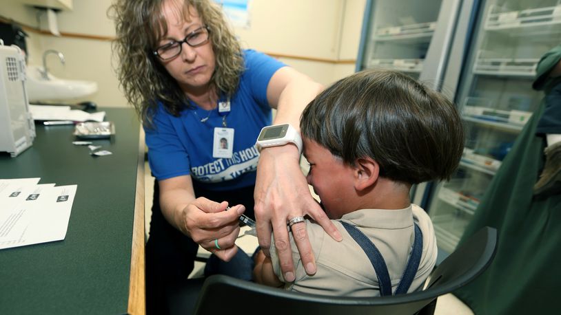 A registered nurse and immunization outreach coordinator with the Knox County Health Department, administers a vaccination to a kid at the facility in Mount Vernon, Ohio, Friday, May 17, 2019. In a report issued Wednesday, Nov. 23, 2022, the World Health Organization and the U.S. Centers for Disease Control and Prevention say measles immunization has dropped significantly since the coronavirus pandemic began, resulting in a record high of nearly 40 million children missing a vaccine dose last year. (AP Photo/Paul Vernon, File)