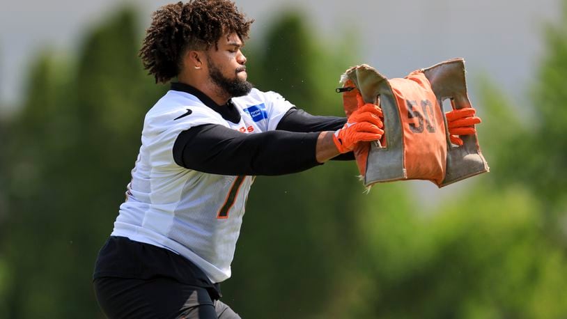 Cincinnati Bengals' Jackson Carman takes part in a drill during NFL football practice in Cincinnati, Tuesday, May 23, 2023. (AP Photo/Aaron Doster)