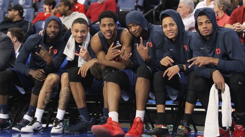 Dayton players pose for a photo on the bench during a game against Saint Louis on Tuesday, Feb. 14, 2017.