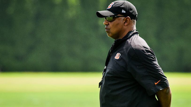 The Cincinnati Bengals’ head coach Marvin Lewis watches the team during organized team activities Tuesday, May 22 at the practice facility near Paul Brown Stadium in Cincinnati. NICK GRAHAM/STAFF