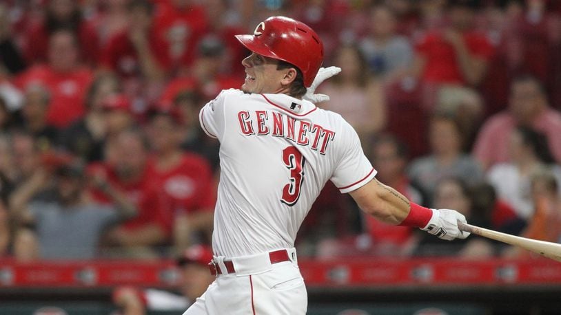 The Reds’ Scooter Gennett doubles to drive in a run in the first inning against the Pirates on Tuesday, May 22, 2018, at Great American Ball Park in Cincinnati. David Jablonski/Staff