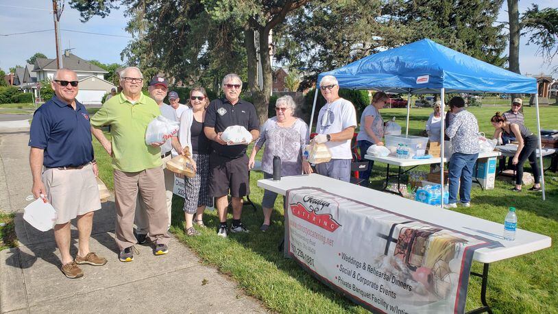 Mike Ivory and his family serve a meal to those affected by the tornadoes. From left to right: Tim Ivory, Jim Ivory, John Ivory, Paula Hoeffer, Mike Ivory, Mary Jo Dahm and Bill Ivory. CONTRIBUTED