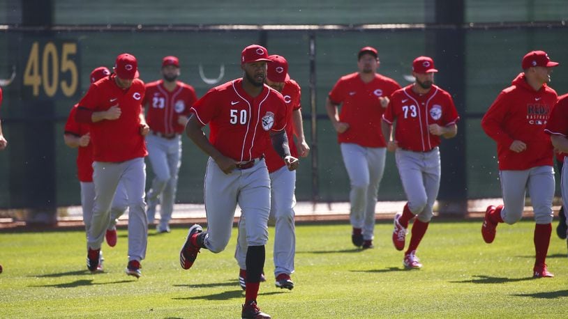 Cincinnati Reds relief pitcher Amir Garrett leads other pitchers in sprints during spring training baseball workouts Monday, Feb. 17, 2020, in Goodyear, Ariz. (AP Photo/Ross D. Franklin)