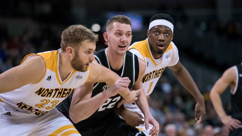 Wright State’s Parker Ernsthausen (center) against Northern Kentucky last season. Joseph Craven/CONTRIBUTED