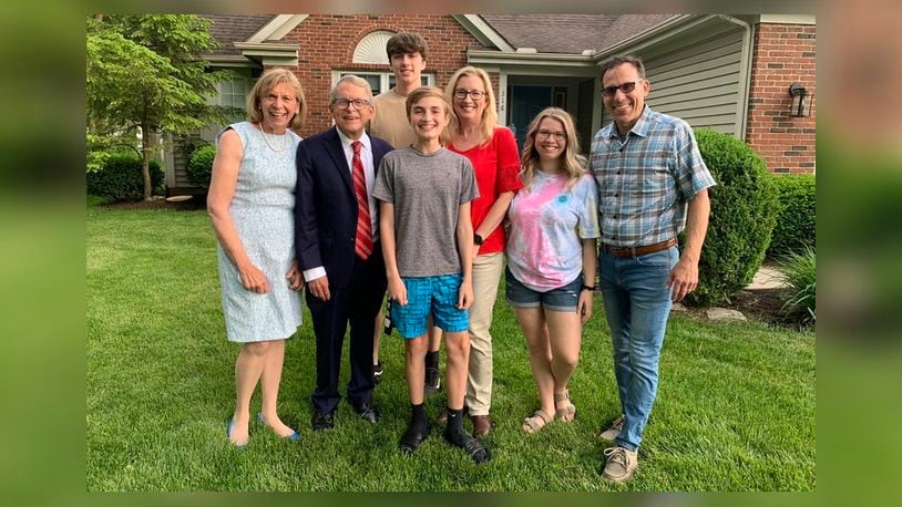 Gov. Mike DeWine and first lady Fran DeWine visited with Joseph Costello, center, who won the first of five full-ride scholarships May 26, 2021, as part of the Ohio Vax-a-Million lottery.