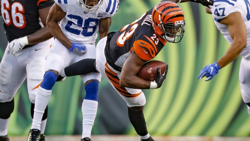 CINCINNATI, OH - AUGUST 30: Brian Hill #23 of the Cincinnati Bengals runs the ball and is stopped from behind by Chris Milton #28 of the Indianapolis Colts during a preseason game at Paul Brown Stadium on August 30, 2018 in Cincinnati, Ohio. (Photo by Michael Hickey/Getty Images)