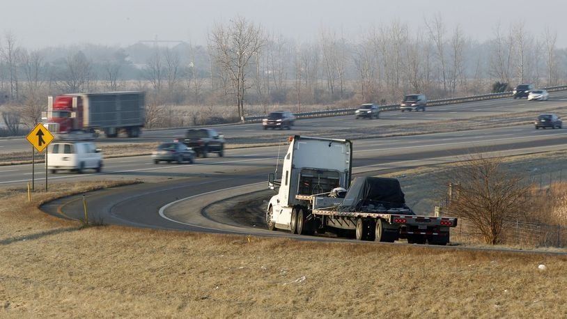 A truck is parked on the ramp from State Route 734 to I-75 southbound in Fayette County at 7:30 a.m. The increase in truck traffic, mandatory rest periods for drivers and the lack of adequate space for truck parking has left many drivers no alternative other than the side of the ramps for rest breaks. TY GREENLEES / STAFF