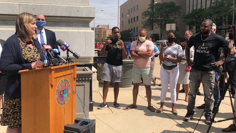 Jared Gandy, wearing a black I Can’t Breathe t-shirt, at the city administration’s press conference on Wednesday in front of Dayton’s city hall. Cory Frolik/Staff photo