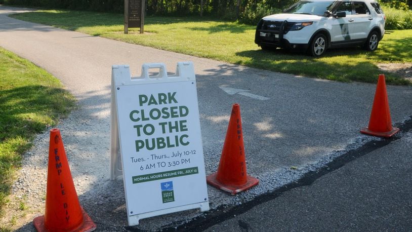 Miamisburg police, the FBI and cadaver dogs were on the scene at Sugarcreek MetroPark on Tuesday, July 10, 2018. MARSHALL GORBY / STAFF