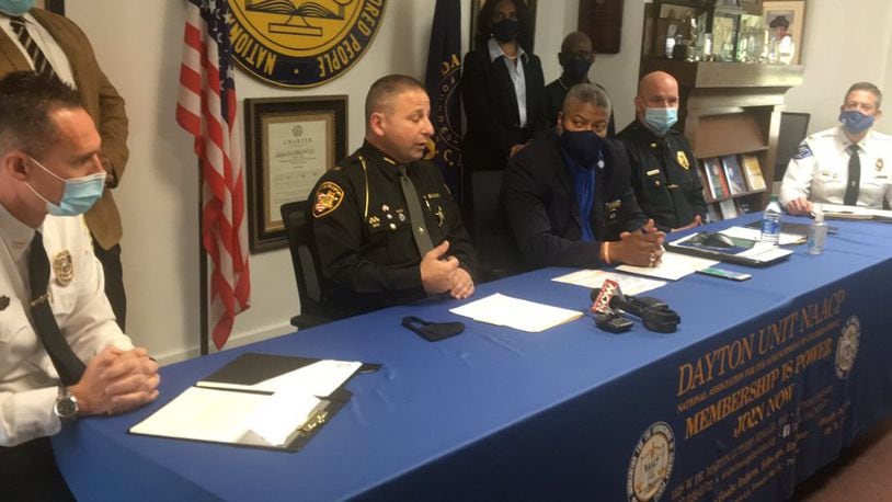 From left, Oakwood Police Chief Alan Hill, Montgomery County Sheriff Rob Streck, NAACP President Derrick L. Foward, Kettering Police Chief Christopher Protsman and Vandalia Police Chief Kurt Althouse gives an update on police reform in the area.