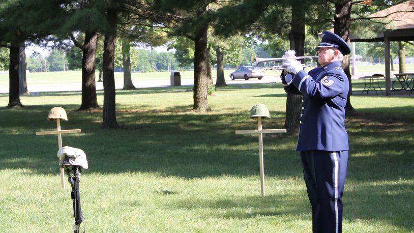 Taps was played May 26, 2016, by bugler Tech. Sgt. Cheryl Przytula, Air Force Band of Flight, during the 2016 Roll Call Memorial Service in the outdoor Memorial Park at the National Museum of the U.S. Air Force, Wright-Patterson Air Force Base. This year’s ceremony falls on May 24 at 9 a.m. and is open to the public. (U.S. Air Force photo/Ted Pitts)