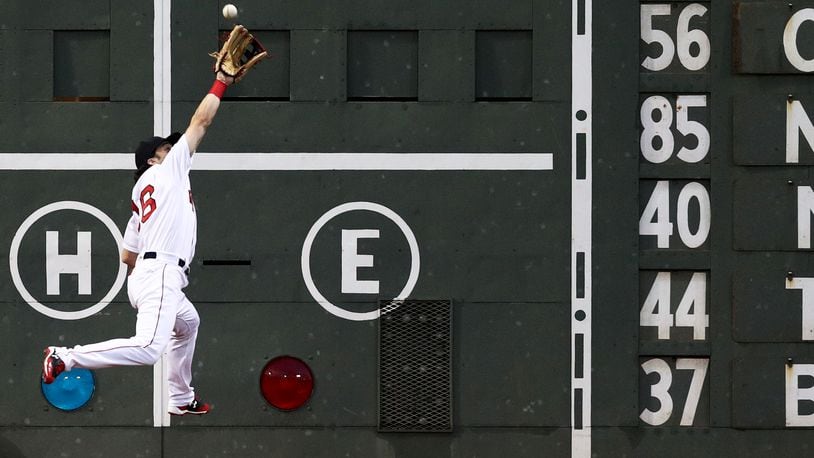 Cincinnati Maderia High School graduate Andrew Benintendi of the Red Sox catches a fly ball hit by Josh Donaldson of the Blue Jays during a July 18 game in Boston's Fenway Park.