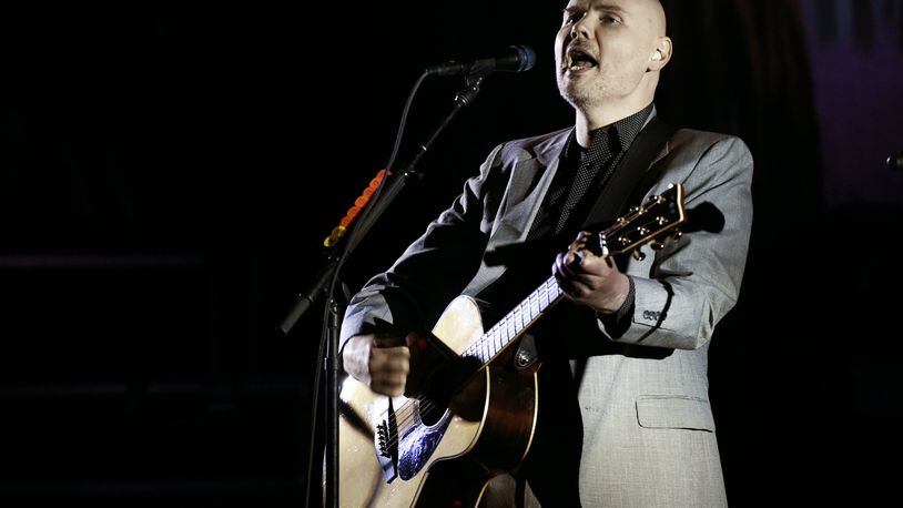 In this Saturday, March 26, 2017 file photo, Billy Corgan of the Smashing Pumpkins performs at The Theatre at Ace Hotel in Los Angeles. The Smashing Pumpkins will return to the stage this summer with their first tour in nearly 20 years to feature founding members Billy Corgan, Jimmy Chamberlin and James Iha. The tour includes stops in Columbus and Indianapolis. (Photo by Chris Pizzello/Invision/AP, File)