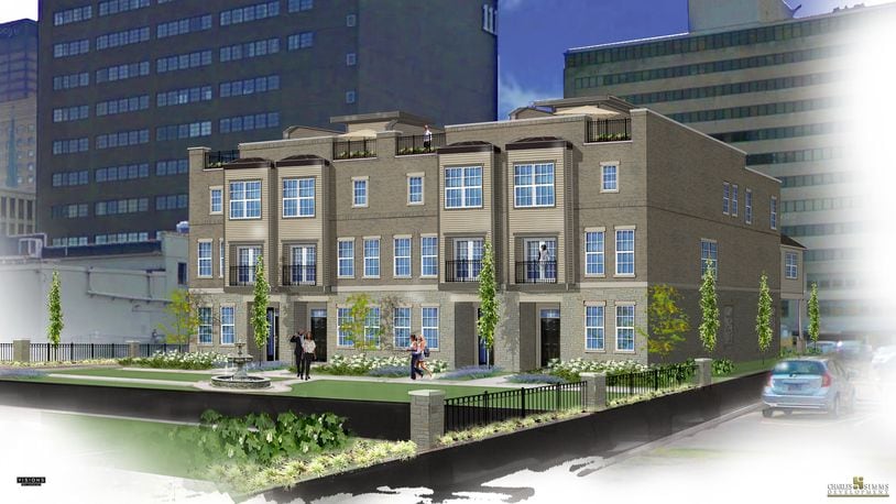 A rendering of the last four townhomes in the Monument Walk community. The development will have green space and an outdoor fountain. SUBMITTED