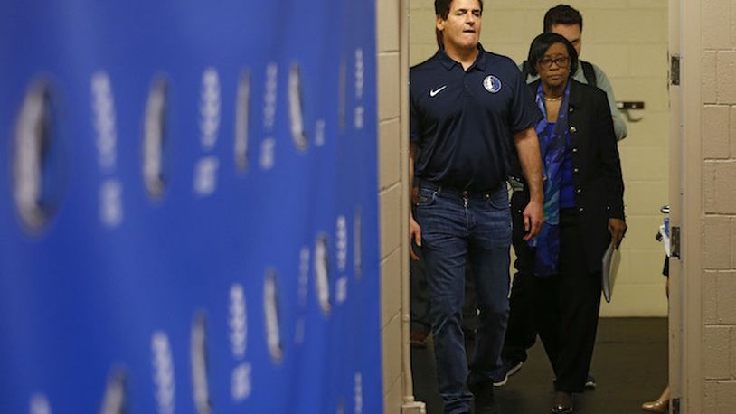 Dallas Mavericks owner Mark Cuban and Dallas Mavericks interim CEO Cynthia Marshall make their way into the room for a press conference on Monday, February 26, 2018 at American Airlines Center in Dallas, Texas. Marshall was hired by the Mavericks to help clean up after the recent sexual harassment scandal in the front office. (Vernon Bryant/Dallas Morning News/TNS)

NO MAGAZINE SALES MANDATORY CREDIT; NO SALES; INTERNET USE BY TNS CONTRIBUTORS ONLY