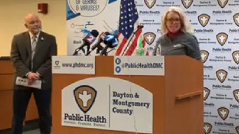 Teresa Williams, chief operating officer for CompuNet, speaks during a Public Health - Dayton &amp; Montgomery County daily press conference on the coronavirus situation Tuesday, March 24, 2020. At left is Health Commissioner Jeff Cooper.