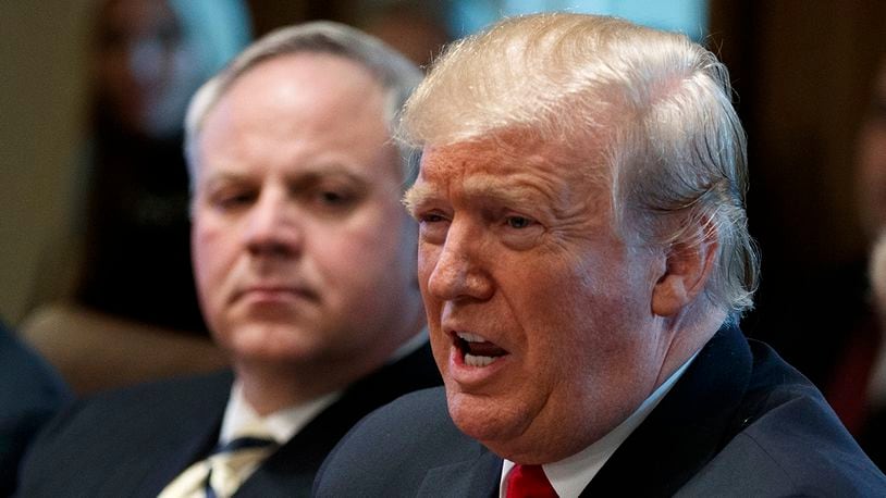 President Donald Trump, with acting Secretary of the Interior David Bernhardt, left, speaks during a cabinet meeting at the White House in Washington. (AP Photo/Evan Vucci)
