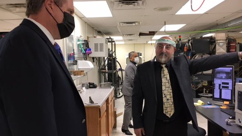 US Rep. Mike Turner, left, with Ayman Salem, chief executive of Material Resources LLC in Beavercreek. Turner toured MRL's labs at the Russ Research Center Tuesday. THOMAS GNAU/STAFF