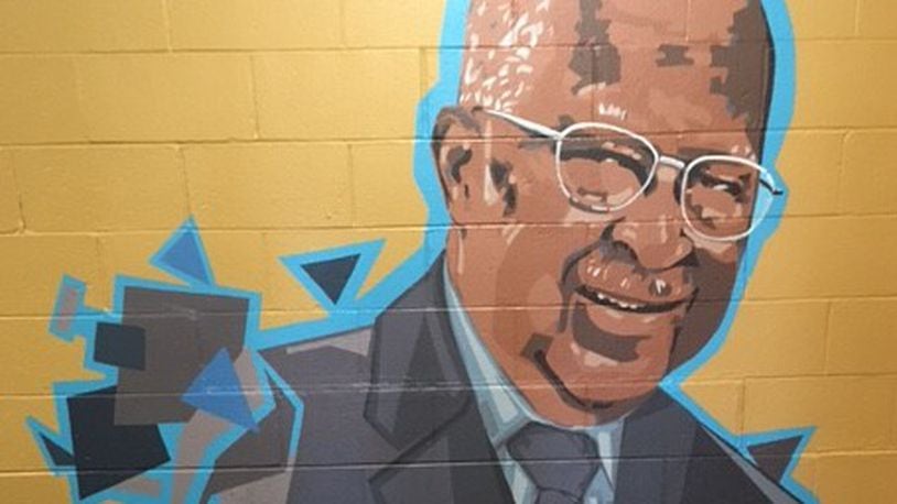 This mural of John E. Moore, by Xenia artist Maggie Reckers, is painted on a wall at Mckinley United Methodist Church (Photo taken by Ray Marcano)