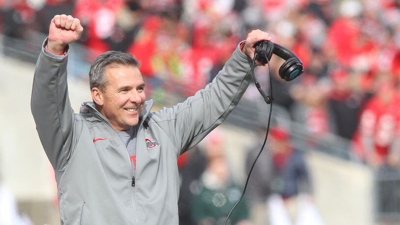 Ohio State coach Urban Meyer celebrates a tackle by the special teams against Michigan State on Saturday, Nov. 11, 2017, at Ohio Stadium in Columbus. David Jablonski/Staff