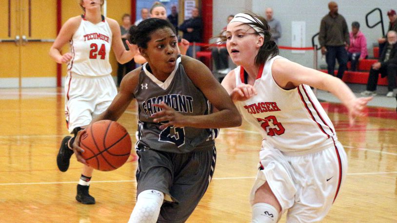 Fairmont’s Makira Webster (left) drives at Tecumseh’s Terah Harness defends in the Firebirds’ 50-35 victory in the Division I sectional final at Troy High School on Monday. GREG BILLING / CONTRIBUTED