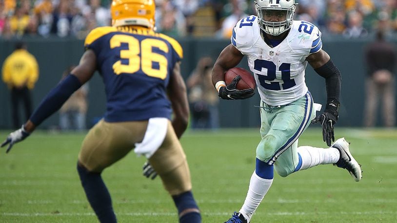 GREEN BAY, WI - OCTOBER 16: Ezekiel Elliott #21 of the Dallas Cowboys looks to avoid the tackle from LaDarius Gunter #36 of the Green Bay Packers during the second quarter at Lambeau Field on October 16, 2016 in Green Bay, Wisconsin. (Photo by Dylan Buell/Getty Images)