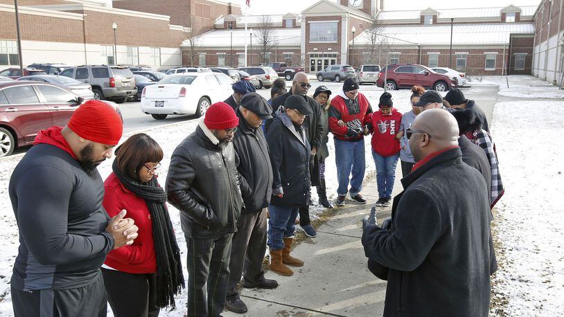 Pastors, parents, elected officials and community members held a prayer rally at Trotwood-Madison High School on March 1, 2019, in response to fights and subsequent arrests that took place at the school. TY GREENLEES / STAFF