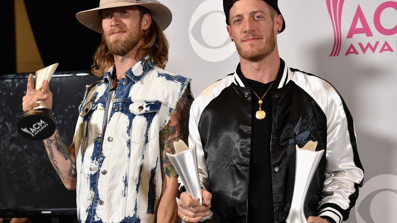 LAS VEGAS, NV - APRIL 02:  Musicians Tyler Hubbard (L) and Brian Kelley of the music group Florida Georgia Line, winners of the award for Vocal Event of the Year and Single Record of the Year, pose in the press room during the 52nd Academy Of Country Music Awards at T-Mobile Arena on April 2, 2017 in Las Vegas, Nevada.  (Photo by Frazer Harrison/Getty Images)