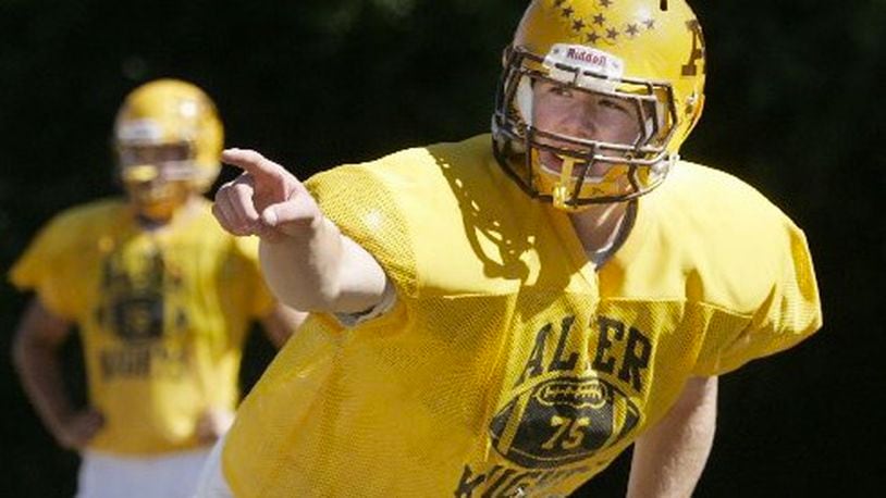 Joe Thuney calles out a signal as he practices with the offensive line during an Alter High School football scrimage in 2010. Ron Alvey/Staff