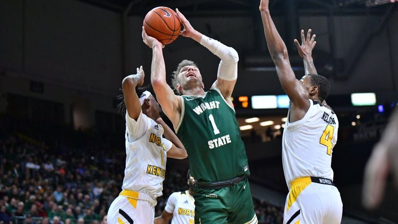Wright State’s Bill Wampler battles in traffic during Friday night’s win over Northern Kentucky. Wampler scored 19 points and had six assists in the Raiders’ 95-63 win. Joseph Craven/WSU Athletics