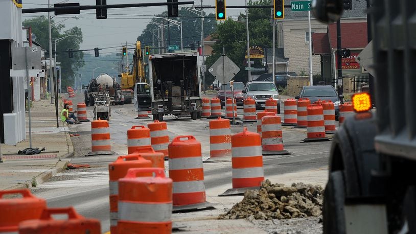 Drivers maneuver through orange traffic barrels Tuesday, June 6, 2023 in Fairborn as construction has started on Ohio 444 near Wright-Patterson Air Force Base. MARSHALL GORBY\STAFF