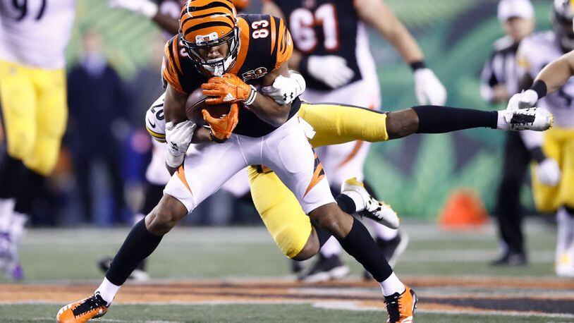 CINCINNATI, OH - DECEMBER 04: Tyler Boyd #83 of the Cincinnati Bengals is tackled by Sean Davis #28 of the Pittsburgh Steelers during the first half at Paul Brown Stadium on December 4, 2017 in Cincinnati, Ohio. (Photo by Andy Lyons/Getty Images)