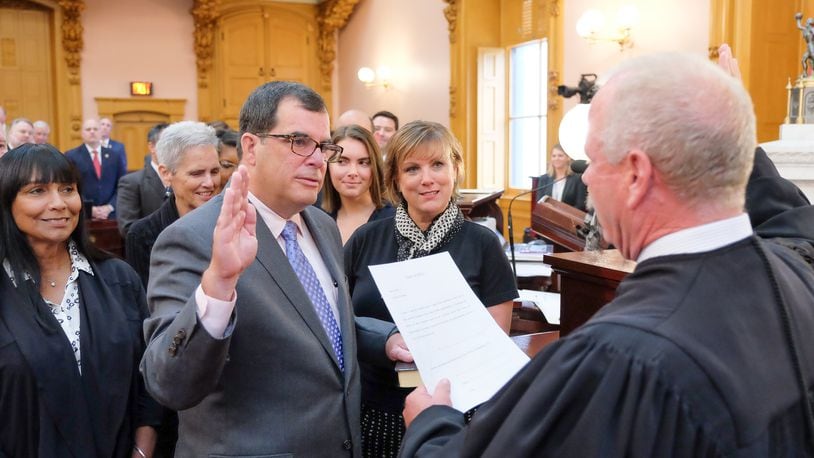 Butler County Area I Court Judge Rob Lyons administers the oath of office to Ohio Rep. George Lang, R-West Chester Twp., who on Wednesday, Sept. 13, 2017, became the representative for the 52nd Ohio House District. CONTRIBUTED