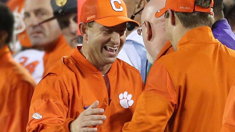 Clemson head coach Dabo Swinney celebrates in the closing seconds of a 42-35 win against Virginia Tech in the Atlantic Coast Conference championship at Camping World Stadium in Orlando, Fla., on December 3, 2016. (Stephen M. Dowell/Orlando Sentinel/TNS)
